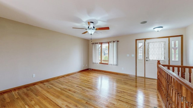 1364 Lone Stone Ct SE, Chatfield, MN 55923 - spare room with light wood-style floors, a ceiling fan, and baseboards