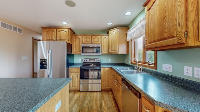 1364 Lone Stone Ct SE, Chatfield, MN 55923 - kitchen featuring stainless steel appliances, a sink, light wood-style floors, and recessed lighting