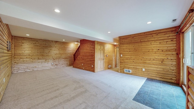 1364 Lone Stone Ct SE, Chatfield, MN 55923 - unfurnished room featuring log walls, recessed lighting, stairs, and light colored carpet