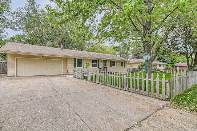ranch-style house with driveway and an attached garage