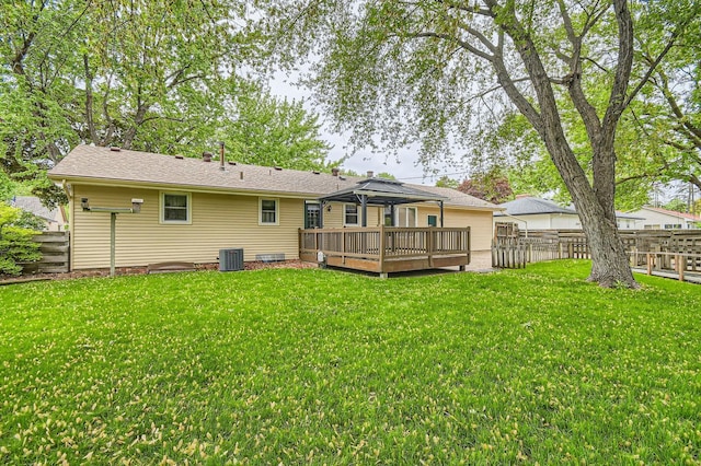 back of property featuring a deck, a gazebo, and cooling unit