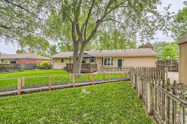 rear view of house featuring a wooden deck