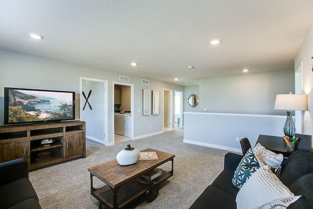 890 Laurel Ct, Chaska, MN 55318 - living area featuring recessed lighting, light colored carpet, washer / clothes dryer, a textured ceiling, and baseboards