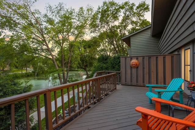 123 Windsor Ct, New Brighton, MN 55112 - wooden deck featuring a water view and view of scattered trees