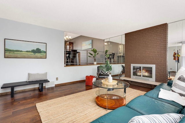 123 Windsor Ct, New Brighton, MN 55112 - living room featuring hardwood / wood-style floors, baseboards, a chandelier, and a fireplace
