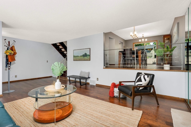 123 Windsor Ct, New Brighton, MN 55112 - living room with a chandelier, baseboards, wood finished floors, and stairway