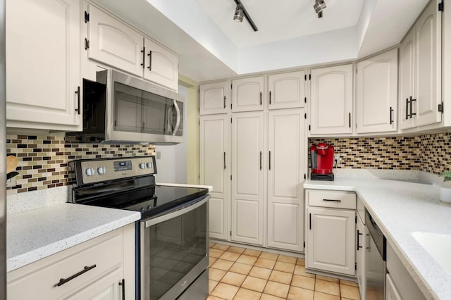 123 Windsor Ct, New Brighton, MN 55112 - kitchen with stainless steel appliances, light tile patterned floors, tasteful backsplash, track lighting, and light stone counters