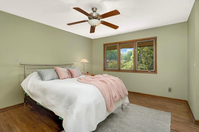 123 Windsor Ct, New Brighton, MN 55112 - bedroom featuring baseboards, wood finished floors, and a ceiling fan