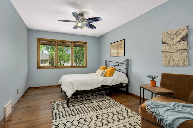 123 Windsor Ct, New Brighton, MN 55112 - bedroom featuring wood finished floors, baseboards, ceiling fan, and a textured ceiling