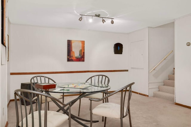 123 Windsor Ct, New Brighton, MN 55112 - dining area featuring light carpet, stairway, and baseboards