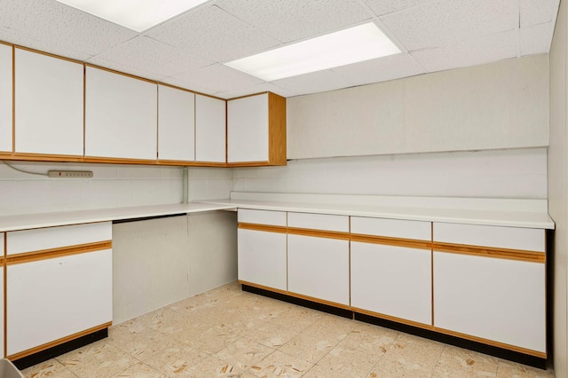 123 Windsor Ct, New Brighton, MN 55112 - kitchen with a paneled ceiling, light countertops, and white cabinetry