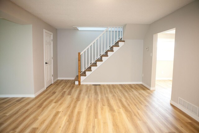 213 Lake Ave, Detroit Lakes, MN 56501 - stairs with wood finished floors and baseboards