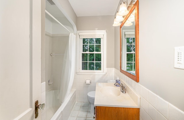 5805 Sunrise Dr, Minneapolis, MN 55419 - full bathroom featuring vanity, tile patterned flooring, shower / bathtub combination with curtain, tile walls, and wainscoting