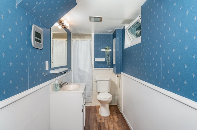 5805 Sunrise Dr, Minneapolis, MN 55419 - bathroom featuring wood finished floors, vanity, wainscoting, and wallpapered walls