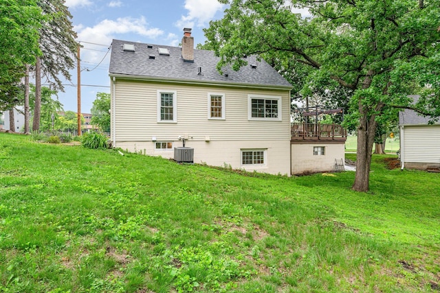 5805 Sunrise Dr, Minneapolis, MN 55419 - back of house featuring a chimney, a yard, a deck, and a shingled roof