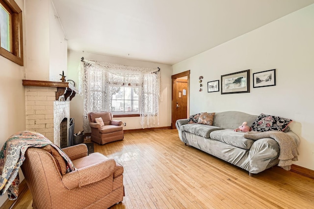1107 Edmund Ave, Saint Paul, MN 55104 - living area featuring light wood-style flooring and a fireplace