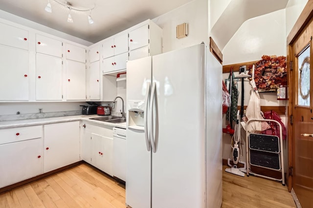 1107 Edmund Ave, Saint Paul, MN 55104 - kitchen featuring white appliances, light wood finished floors, light countertops, and white cabinets