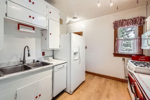 1107 Edmund Ave, Saint Paul, MN 55104 - kitchen featuring white appliances, light countertops, light wood-type flooring, and white cabinets