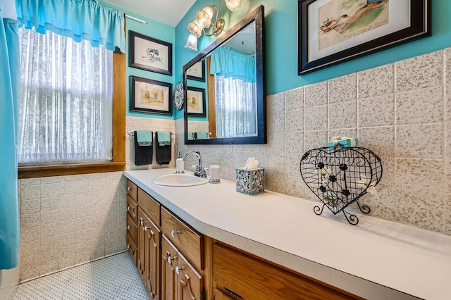 1107 Edmund Ave, Saint Paul, MN 55104 - full bathroom with tile walls, vanity, and tile patterned floors