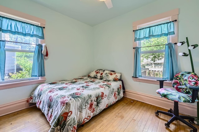 1107 Edmund Ave, Saint Paul, MN 55104 - bedroom featuring multiple windows, hardwood / wood-style flooring, and ceiling fan