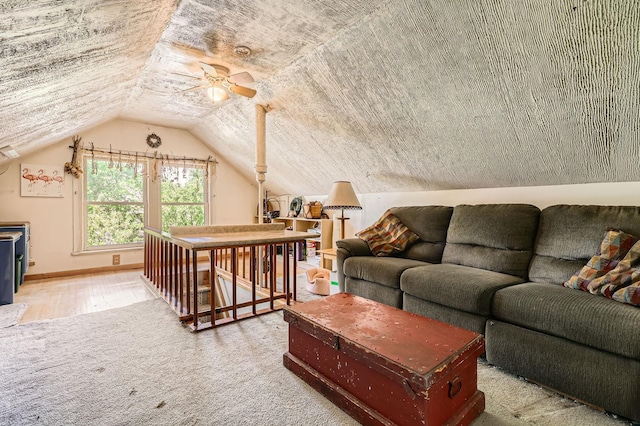 1107 Edmund Ave, Saint Paul, MN 55104 - living room featuring a ceiling fan, vaulted ceiling, and wood finished floors