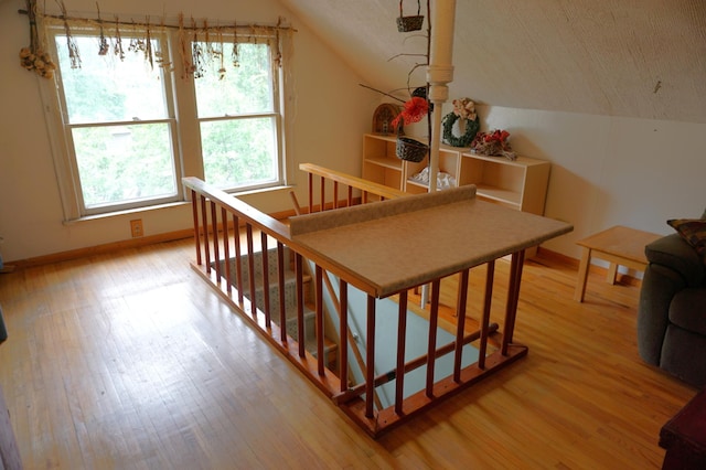 1107 Edmund Ave, Saint Paul, MN 55104 - stairway featuring lofted ceiling and wood finished floors