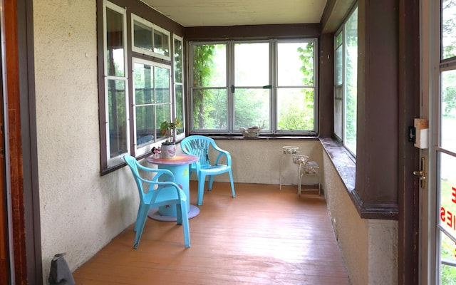 1107 Edmund Ave, Saint Paul, MN 55104 - sunroom featuring a textured wall, plenty of natural light, and wood-type flooring