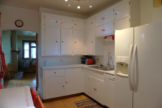 1107 Edmund Ave, Saint Paul, MN 55104 - kitchen featuring white appliances, light wood-style floors, light countertops, and white cabinets