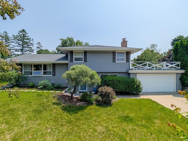 3466 Yukon Ave N, New Hope, MN 55427 - split level home featuring a chimney, a front lawn, an attached garage, and concrete driveway