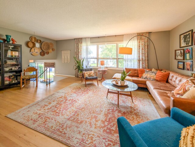 3466 Yukon Ave N, New Hope, MN 55427 - living room featuring wood finished floors and a textured ceiling