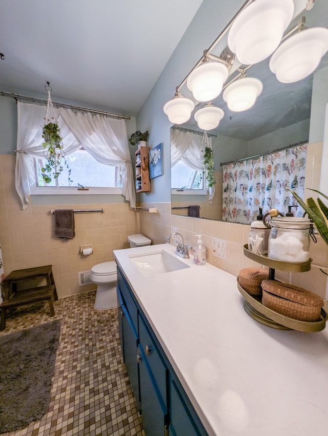 3466 Yukon Ave N, New Hope, MN 55427 - full bath with healthy amount of natural light, tile walls, vanity, a shower with shower curtain, and tile patterned floors