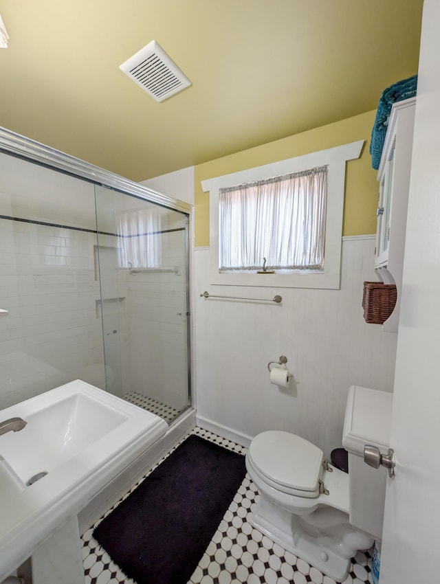 3466 Yukon Ave N, New Hope, MN 55427 - bathroom featuring a stall shower and wainscoting