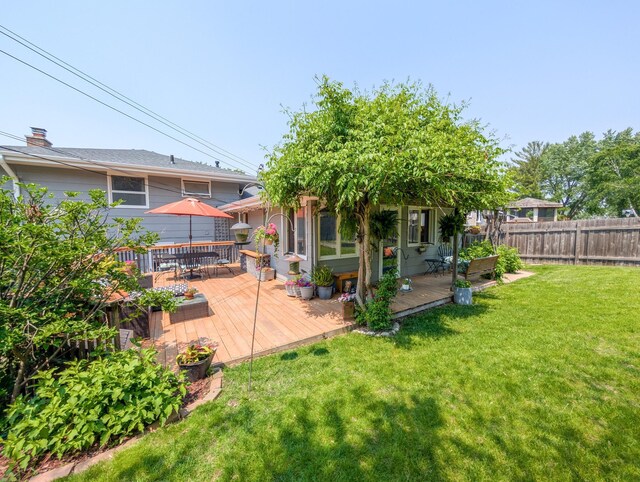 3466 Yukon Ave N, New Hope, MN 55427 - rear view of house featuring a deck and outdoor dining space