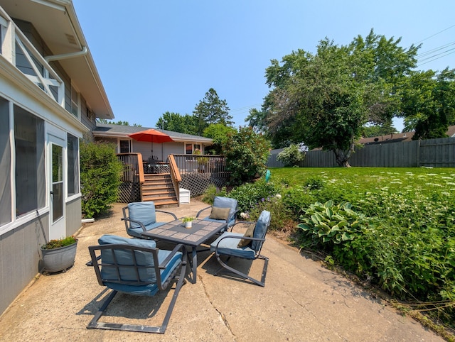3466 Yukon Ave N, New Hope, MN 55427 - fenced backyard with outdoor dining space, a patio area, and a wooden deck