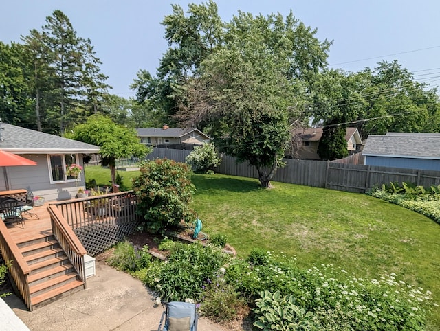 3466 Yukon Ave N, New Hope, MN 55427 - fenced backyard with a wooden deck and outdoor dining space