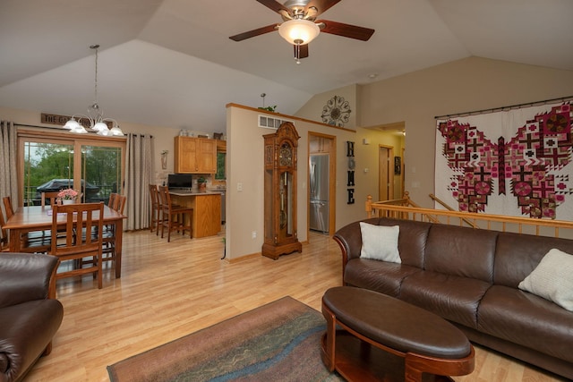 420 Cedar Ct NE, Pine Island, MN 55963 - living area featuring lofted ceiling, a chandelier, a ceiling fan, and light wood-type flooring