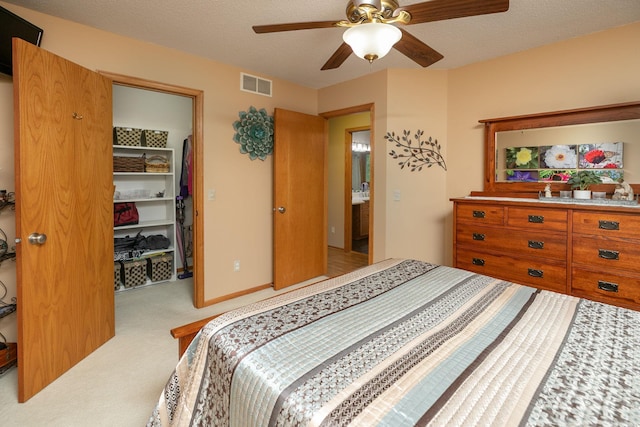 420 Cedar Ct NE, Pine Island, MN 55963 - bedroom featuring carpet flooring, a walk in closet, a ceiling fan, and a closet