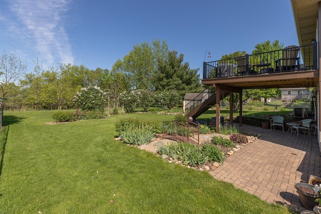 420 Cedar Ct NE, Pine Island, MN 55963 - view of green lawn with stairway, a patio area, and a deck