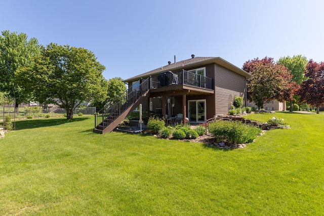420 Cedar Ct NE, Pine Island, MN 55963 - back of house featuring stairs, a yard, and a wooden deck