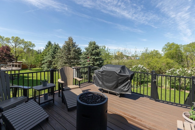 420 Cedar Ct NE, Pine Island, MN 55963 - wooden terrace with area for grilling and a lawn