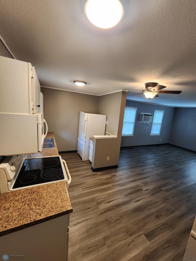 1033 27th St N, Fargo, ND 58102 - kitchen with white appliances, white cabinetry, dark wood-style flooring, ceiling fan, and a textured ceiling