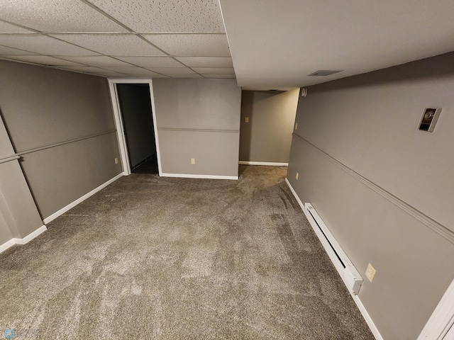 1033 27th St N, Fargo, ND 58102 - finished below grade area with carpet, baseboards, a baseboard heating unit, and a drop ceiling