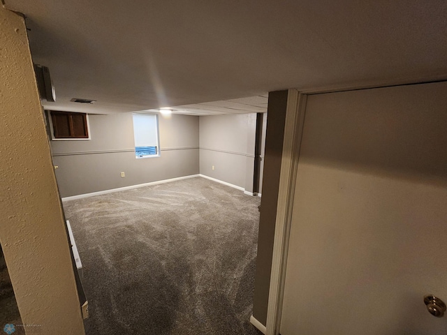 1033 27th St N, Fargo, ND 58102 - below grade area featuring carpet floors and baseboards