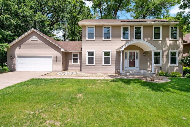 13545 Glasgow Ln, Apple Valley, MN 55124 - colonial inspired home featuring an attached garage, driveway, a front lawn, and roof with shingles