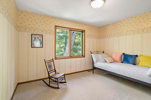 13545 Glasgow Ln, Apple Valley, MN 55124 - bedroom with wallpapered walls, carpet, a textured ceiling, and baseboards