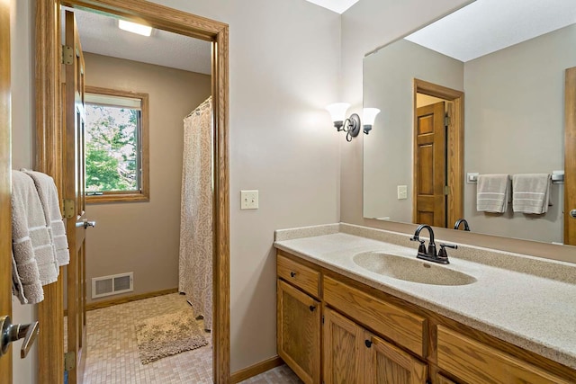 13545 Glasgow Ln, Apple Valley, MN 55124 - bathroom featuring vanity and baseboards