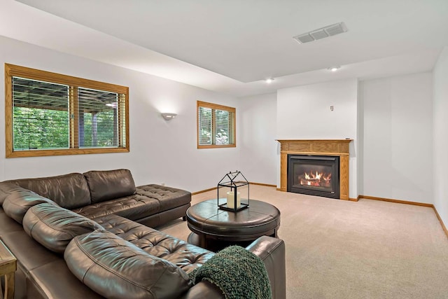 13545 Glasgow Ln, Apple Valley, MN 55124 - living room featuring light colored carpet, a glass covered fireplace, and baseboards