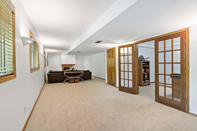 13545 Glasgow Ln, Apple Valley, MN 55124 - interior space with french doors, a lit fireplace, and baseboards