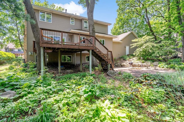 13545 Glasgow Ln, Apple Valley, MN 55124 - rear view of house with stairs, a wooden deck, and a patio