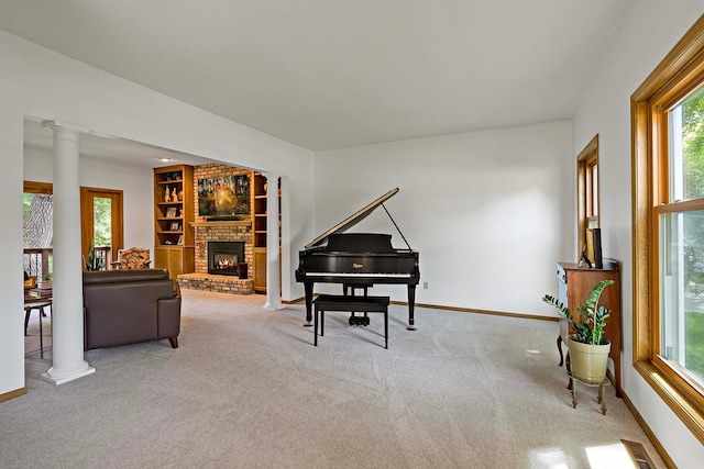 13545 Glasgow Ln, Apple Valley, MN 55124 - living room featuring plenty of natural light, carpet, ornate columns, and baseboards